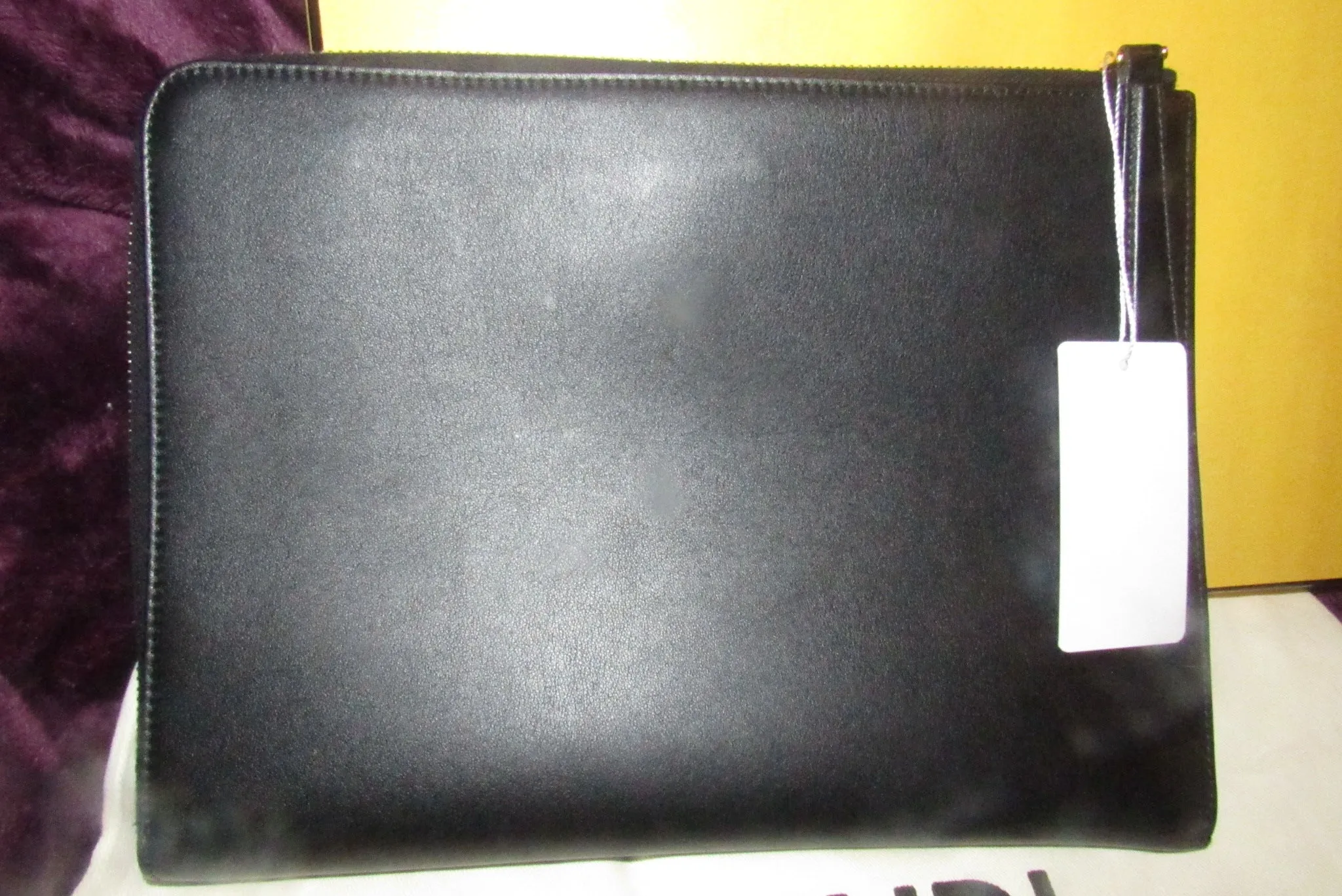 Fendi NIB w tags, black leather 'Monster' clutch w yellow fur lashes and zip around closure