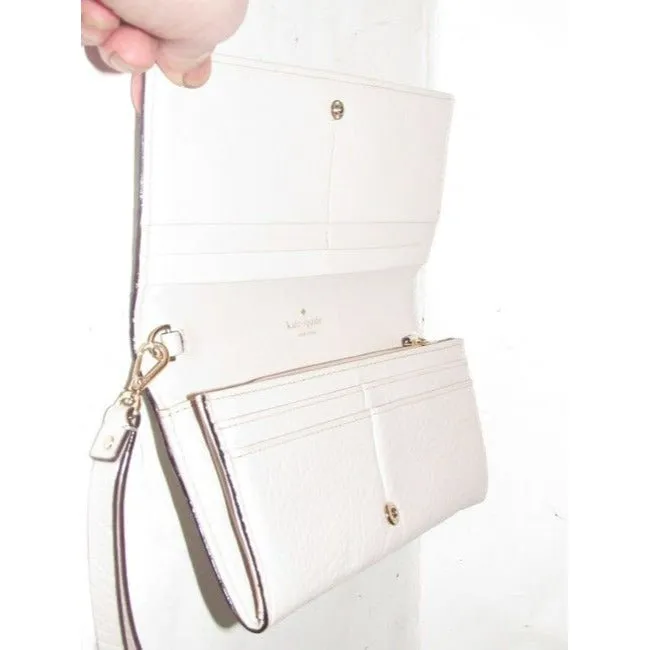 SALE! Kate Spade Pale Pink Leather With A Cut Out Design And Wrist Strap Wallet
